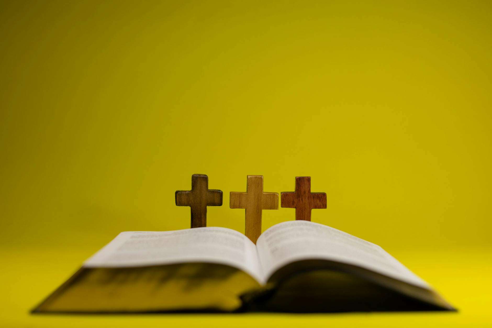 Bible with cross and warm light representing biblically responsible investing grounded in faith
