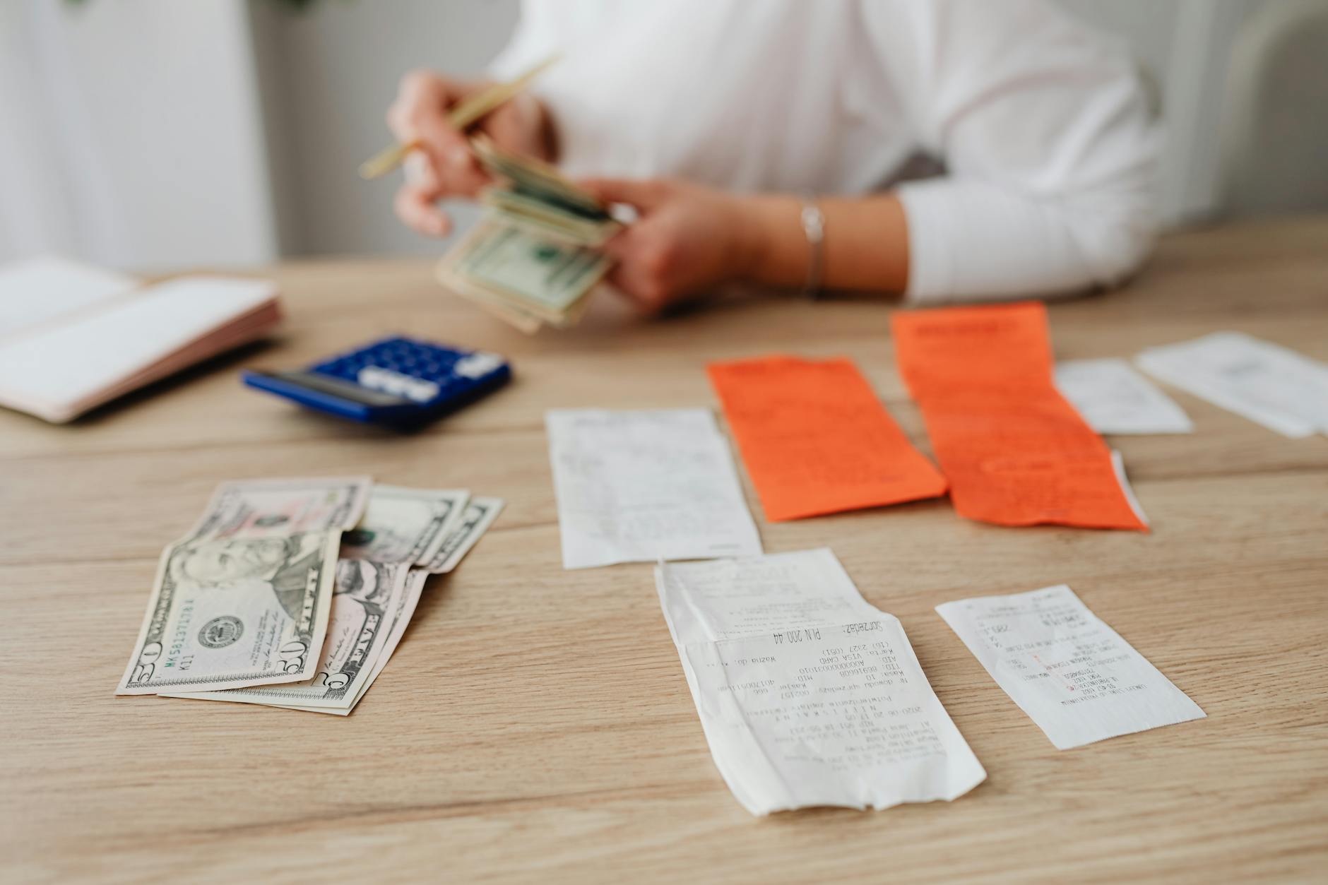 Family working together on a budget plan at kitchen table