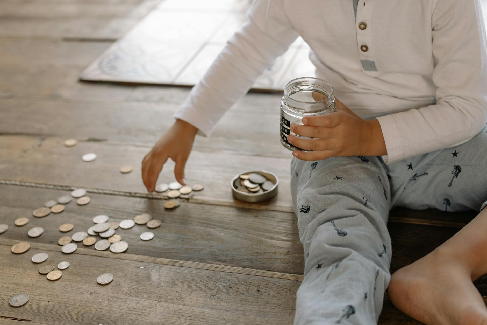 Parent teaching child about saving money from a biblical perspective