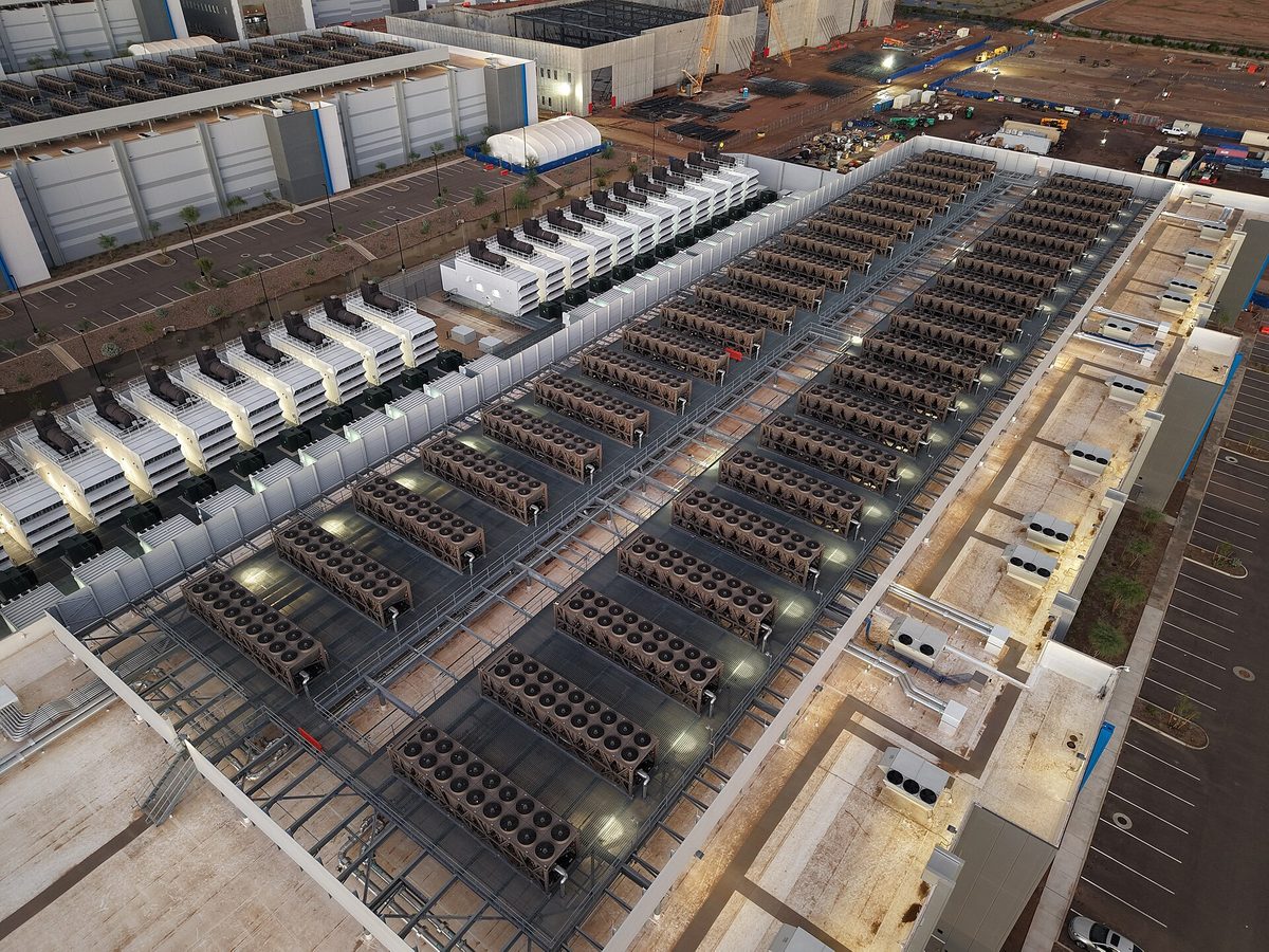 Rows of servers in a data center, representing technology stocks